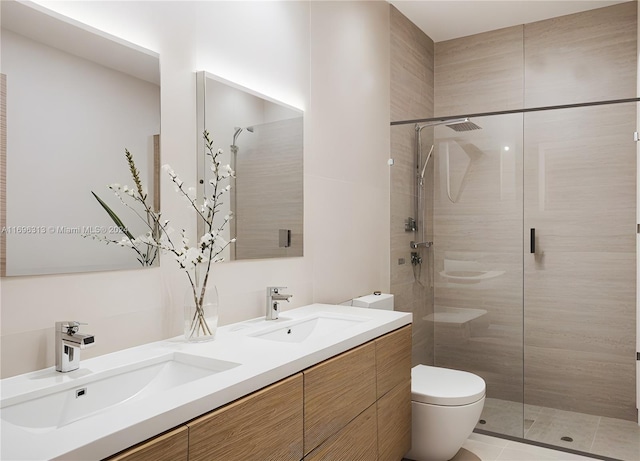 bathroom with tiled shower, tile patterned floors, vanity, and toilet