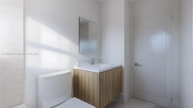 bathroom with tile patterned flooring, vanity, and toilet