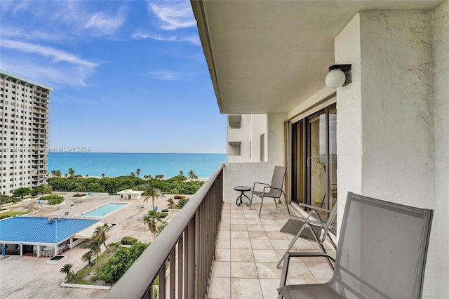 balcony featuring a water view