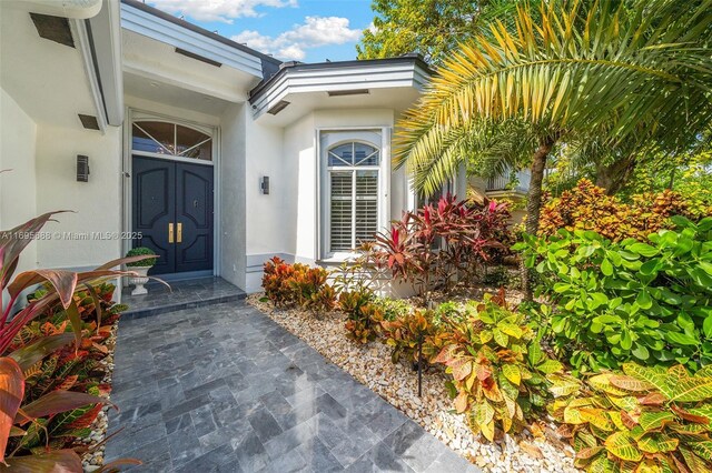 view of front of property with a garage and a front lawn