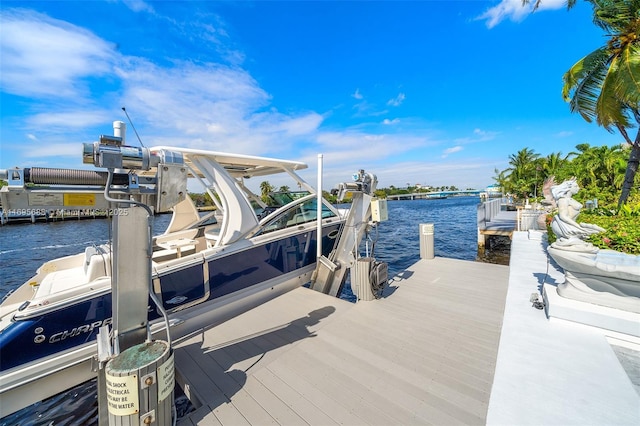 view of dock featuring a water view and boat lift