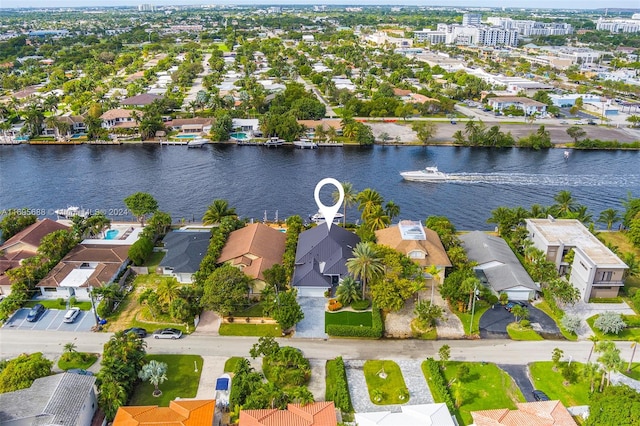 birds eye view of property featuring a water view