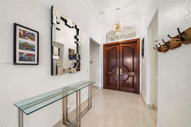 interior space featuring a chandelier and crown molding