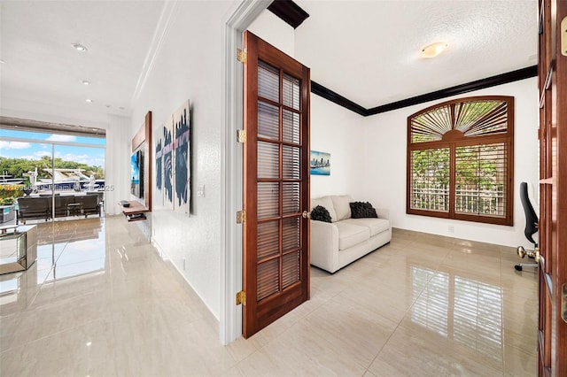 tiled office featuring crown molding and a textured ceiling