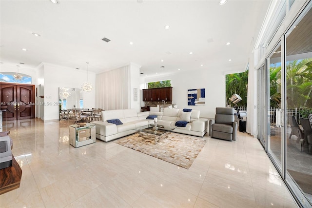 living area with visible vents, ornamental molding, a notable chandelier, and recessed lighting