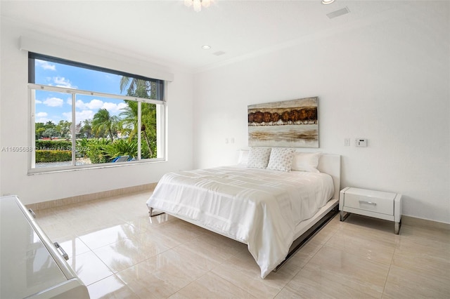 bedroom with ornamental molding