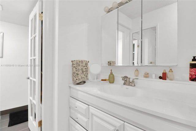 bathroom with vanity and tile patterned floors