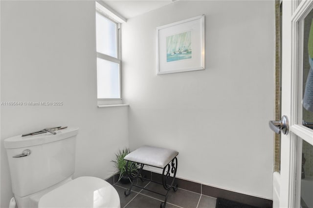 bathroom featuring tile patterned floors and toilet