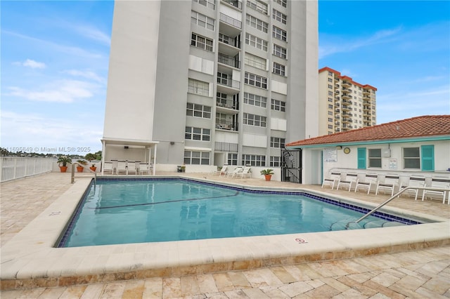 view of swimming pool featuring a patio area