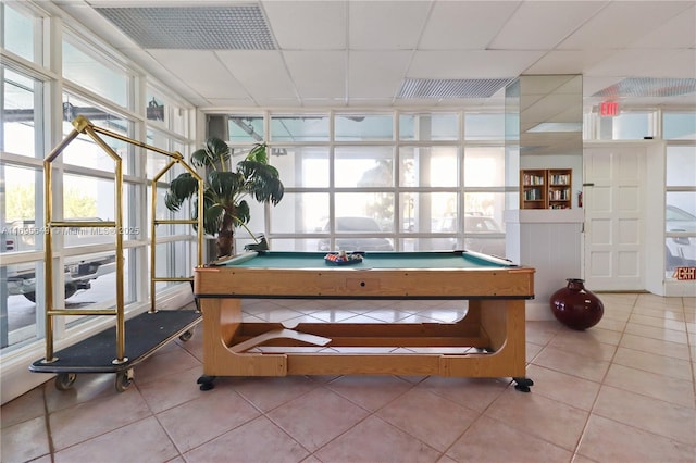 rec room featuring tile patterned flooring, pool table, and a drop ceiling