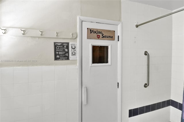 bathroom with a tile shower