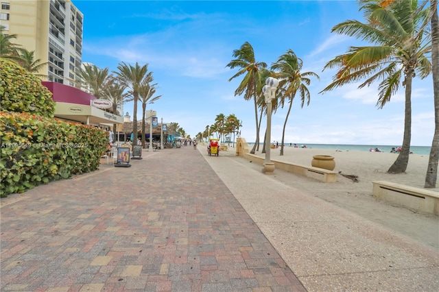 view of street featuring a water view and a view of the beach