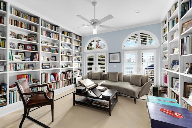 sitting room with light colored carpet and ceiling fan