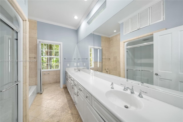 bathroom featuring tile patterned flooring, vanity, ornamental molding, and walk in shower