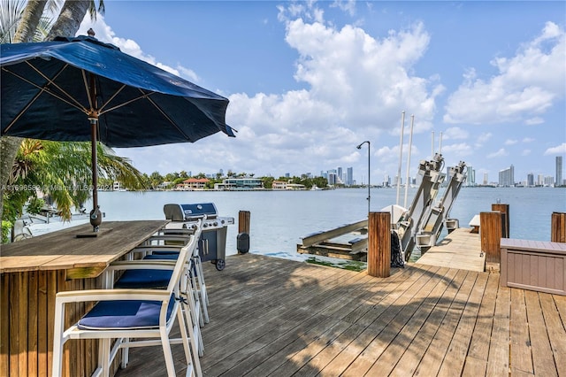 814 W Dilido Dr, Miami Beach, FL 33139 - dock featuring boat lift, a water view, and a view of skyline
