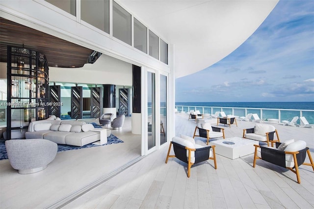 3101 Bayshore Dr Unit 1602, Fort Lauderdale, FL 33304 - view of patio featuring an outdoor living space with a fire pit and a water view