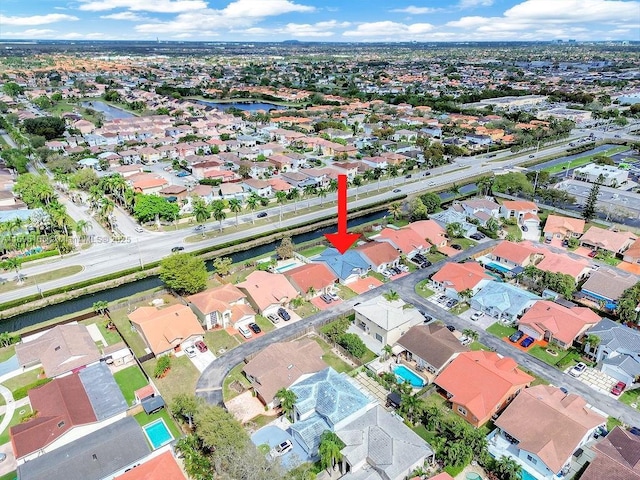 birds eye view of property with a residential view