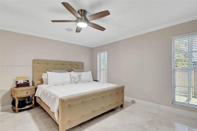 bedroom with ceiling fan and ornamental molding