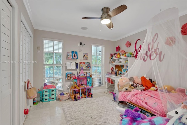 tiled bedroom with multiple windows, ceiling fan, and ornamental molding