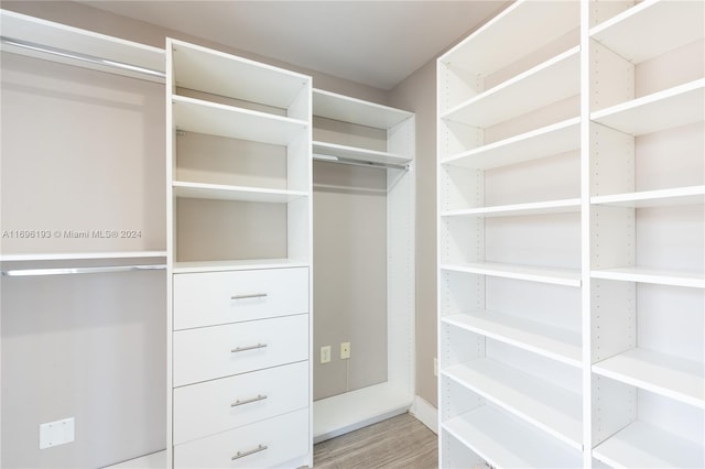 walk in closet featuring wood-type flooring