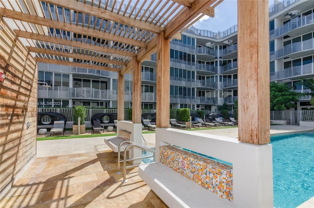 view of swimming pool with a pergola and a patio area