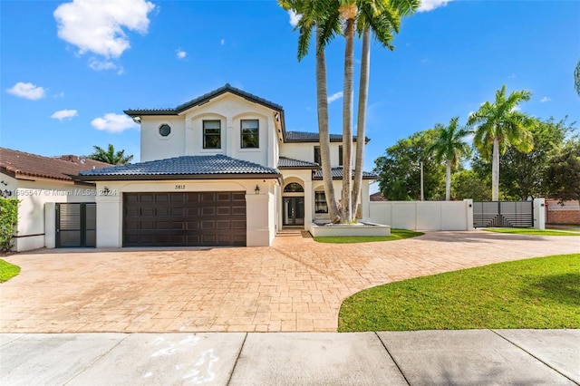 mediterranean / spanish-style house featuring a garage