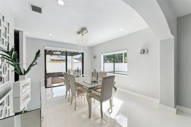 dining space featuring a chandelier