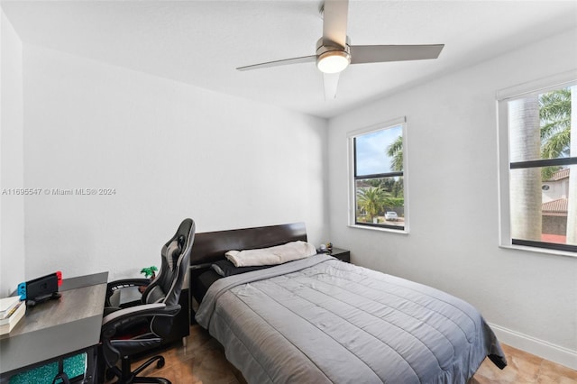 bedroom with multiple windows and ceiling fan