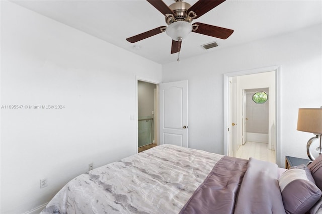 bedroom with ensuite bathroom and ceiling fan