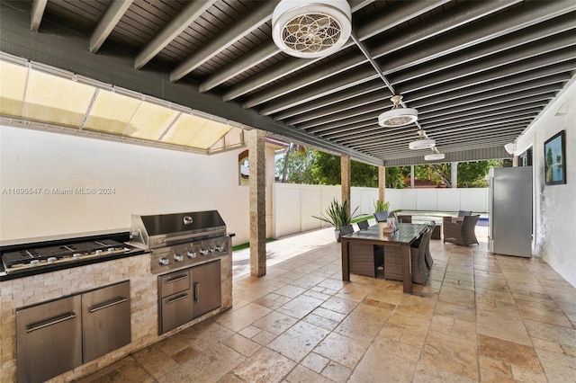 view of patio featuring grilling area and exterior kitchen