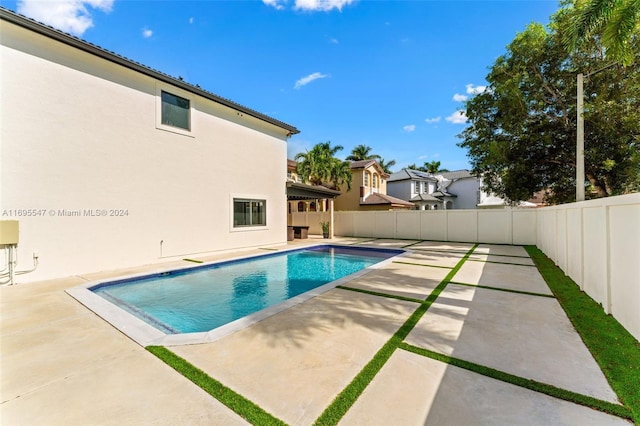 view of swimming pool featuring a patio