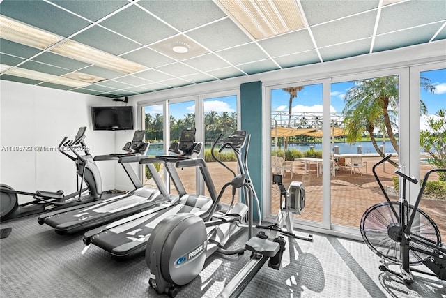 9102 W Bay Hbr Unit 4B, Bay Harbor Islands, FL 33154 - workout area featuring a wealth of natural light and a drop ceiling