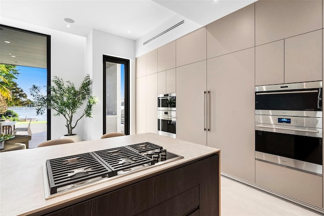 kitchen with dark brown cabinetry and stainless steel appliances