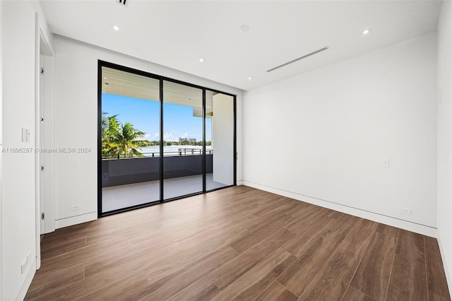 spare room featuring hardwood / wood-style flooring