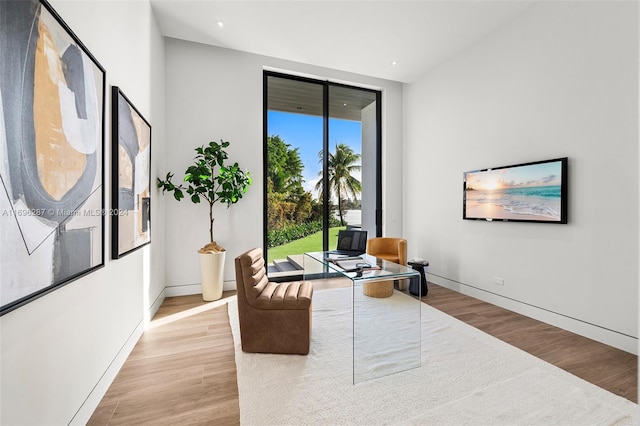 office area with light hardwood / wood-style floors