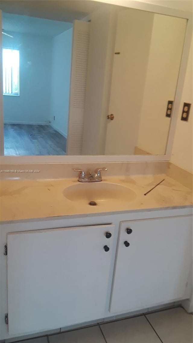 bathroom with tile patterned floors and vanity