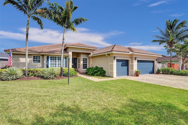 mediterranean / spanish house featuring a garage and a front lawn