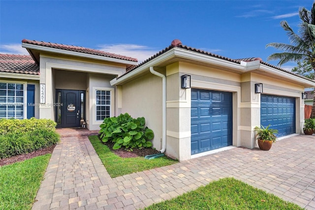 view of front of home with a garage