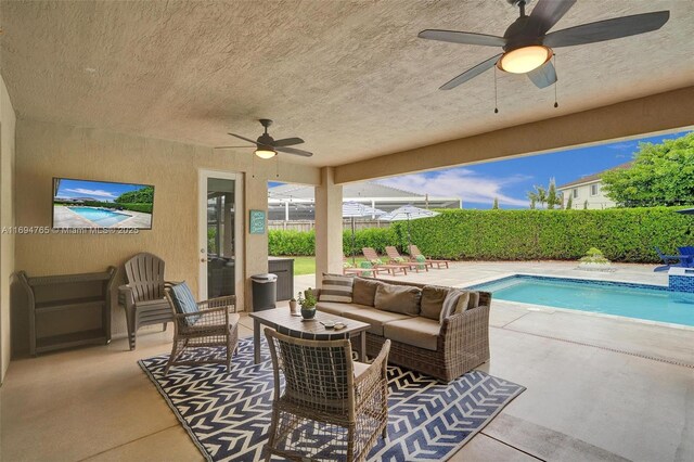 view of pool featuring a patio, an outdoor hangout area, and ceiling fan