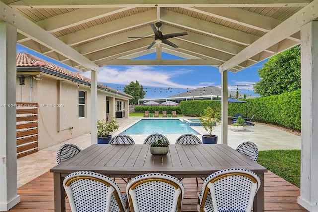 view of pool with a patio and ceiling fan