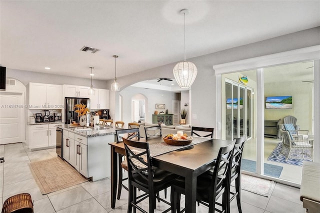 dining area with sink and light tile patterned floors