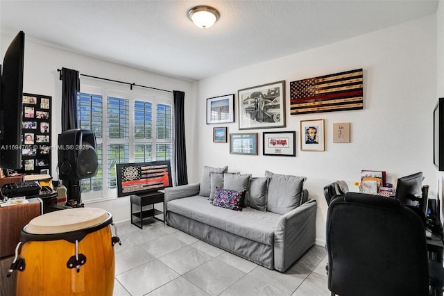 tiled living room featuring a textured ceiling