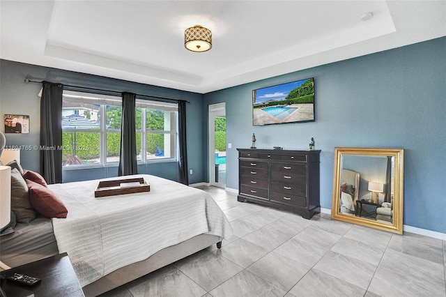 bedroom featuring a raised ceiling