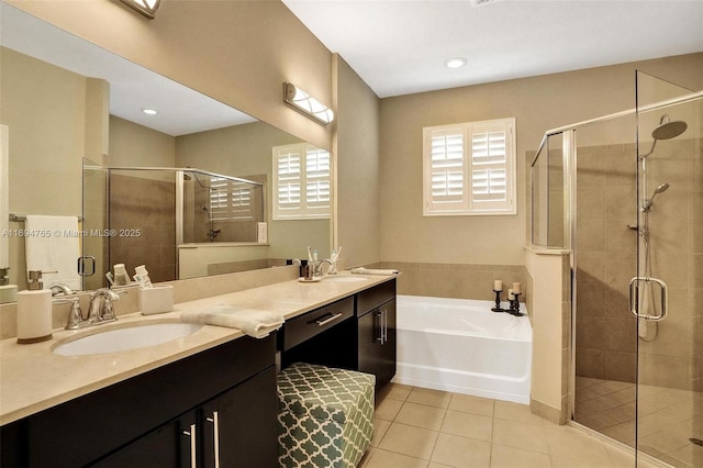 bathroom with separate shower and tub, vanity, and tile patterned flooring