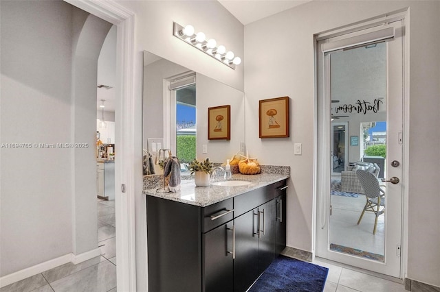 washroom with light tile patterned floors, cabinets, and independent washer and dryer