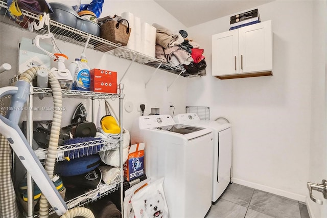 washroom featuring independent washer and dryer and cabinets