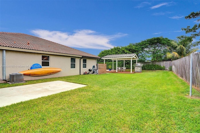 view of yard featuring a patio, a gazebo, and central AC