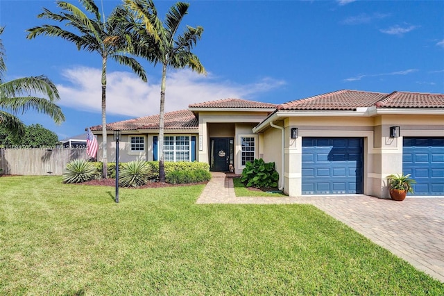 view of front facade with a front yard and a garage