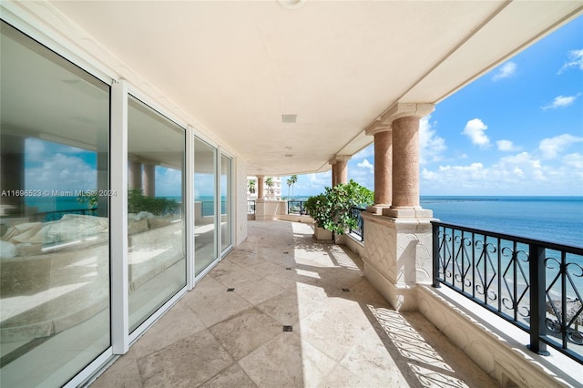 balcony featuring a water view