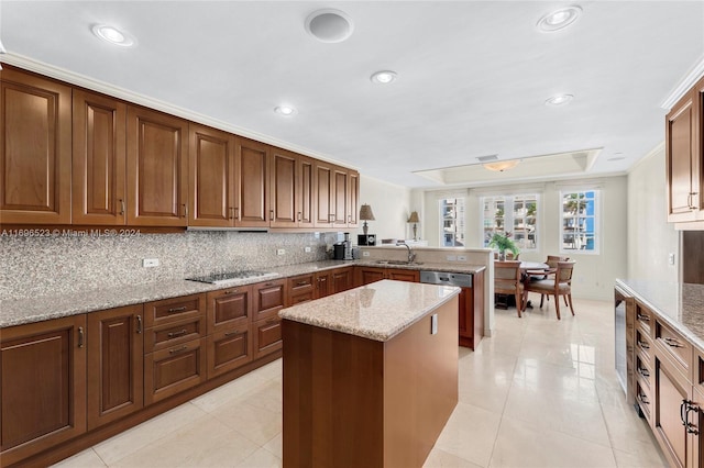 kitchen featuring kitchen peninsula, black electric stovetop, light stone countertops, ornamental molding, and sink